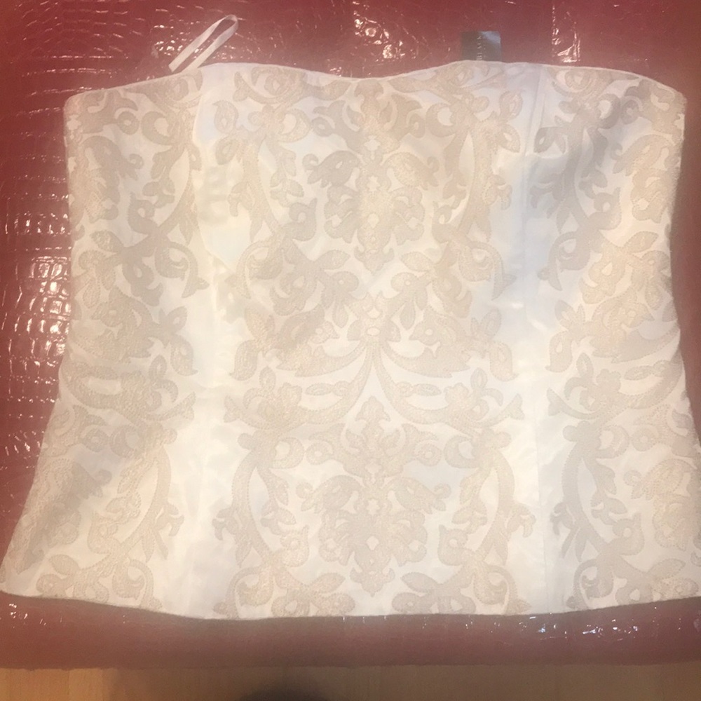 White House Black Market cream and gold bustier.